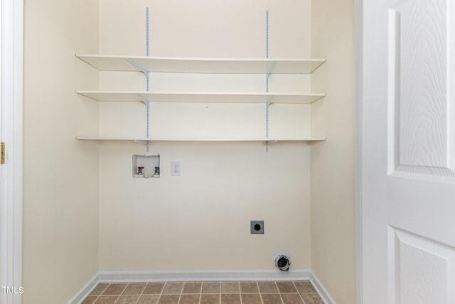 clothes washing area featuring laundry area, baseboards, washer hookup, and hookup for an electric dryer