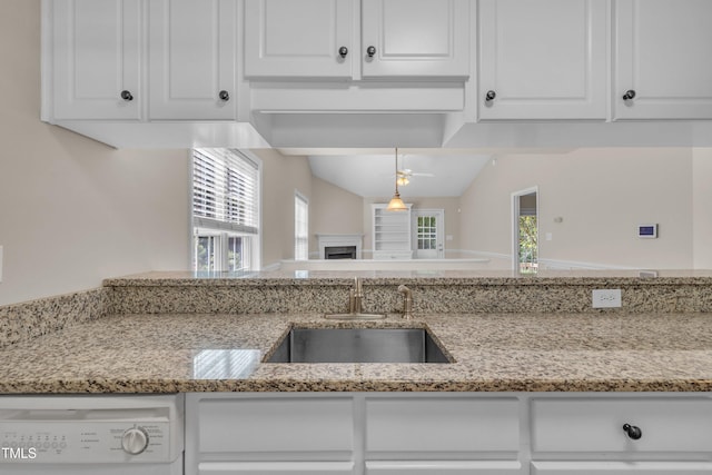 1614 W Cotton Gin Dr, Clayton, NC 27527 - kitchen featuring a sink, white dishwasher, white cabinets, light stone counters, and a ceiling fan