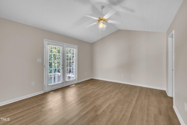 1614 W Cotton Gin Dr, Clayton, NC 27527 - unfurnished room with ceiling fan, wood finished floors, lofted ceiling, and baseboards
