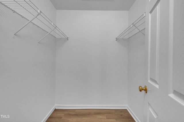 1614 W Cotton Gin Dr, Clayton, NC 27527 - spacious closet featuring wood finished floors