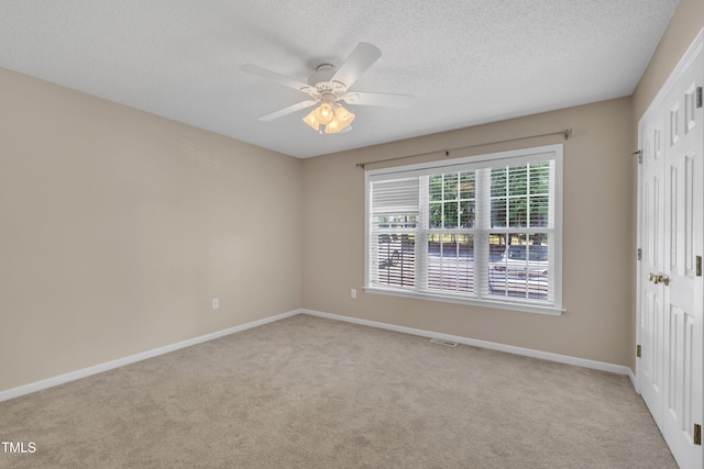 1614 W Cotton Gin Dr, Clayton, NC 27527 - unfurnished bedroom featuring light carpet, a textured ceiling, baseboards, a closet, and ceiling fan