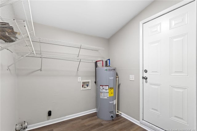 washroom with hookup for a washing machine, electric water heater, laundry area, dark wood-style flooring, and baseboards