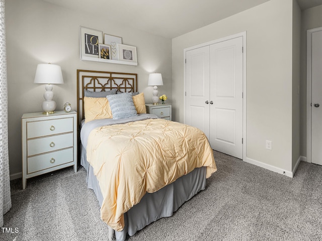 bedroom with carpet floors, a closet, and baseboards