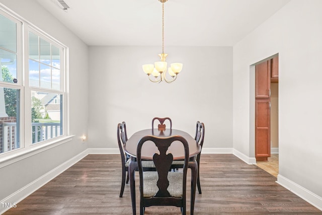 4508 Brintons Cottage St, Raleigh, NC 27616 - dining space with a chandelier, plenty of natural light, and dark wood-type flooring