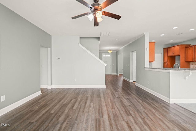 4508 Brintons Cottage St, Raleigh, NC 27616 - unfurnished living room featuring a ceiling fan, dark wood-style floors, baseboards, recessed lighting, and a sink