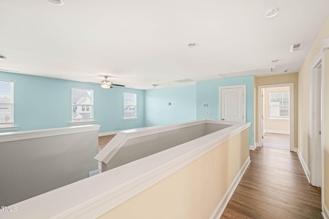 4508 Brintons Cottage St, Raleigh, NC 27616 - corridor featuring attic access, wood finished floors, baseboards, and an upstairs landing