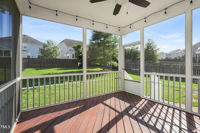 4508 Brintons Cottage St, Raleigh, NC 27616 - unfurnished sunroom with rail lighting, a ceiling fan, and a residential view