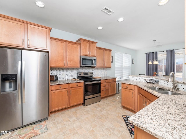 4508 Brintons Cottage St, Raleigh, NC 27616 - kitchen with appliances with stainless steel finishes, a sink, plenty of natural light, backsplash, and recessed lighting