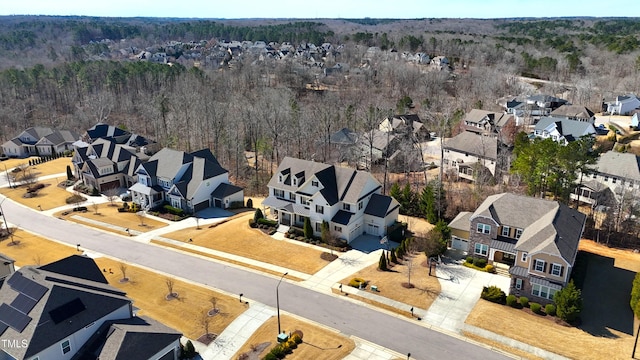 bird's eye view with a forest view and a residential view