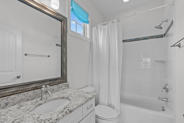 bathroom featuring vanity, toilet, and shower / tub combo with curtain