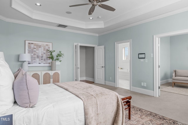 bedroom with carpet, a raised ceiling, visible vents, and baseboards