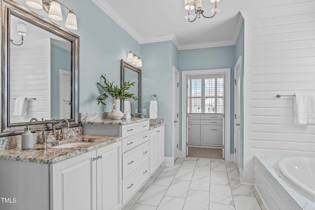 full bath with marble finish floor, crown molding, vanity, baseboards, and a bath