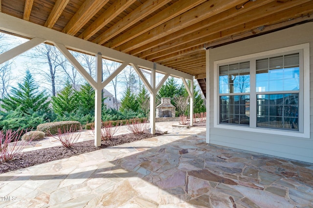 view of patio / terrace with an outdoor stone fireplace