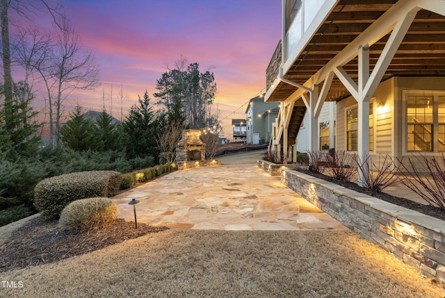 view of patio featuring exterior fireplace