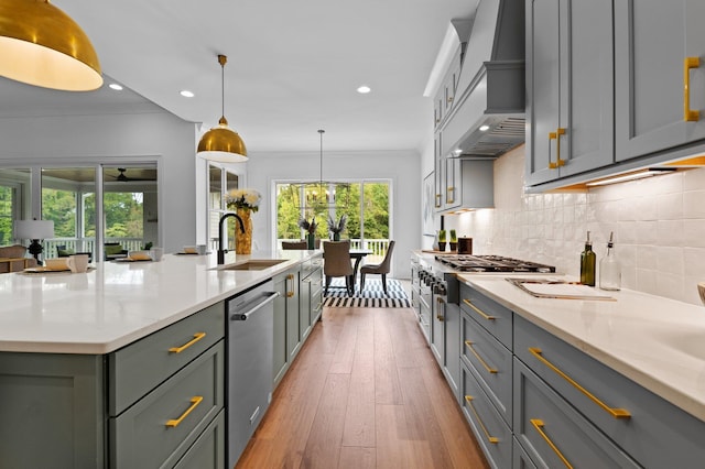 kitchen with pendant lighting, a sink, and gray cabinetry