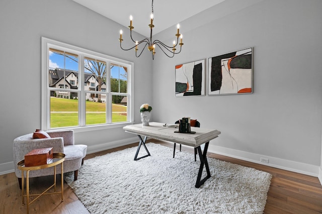 office area with dark wood-style flooring, a notable chandelier, and baseboards