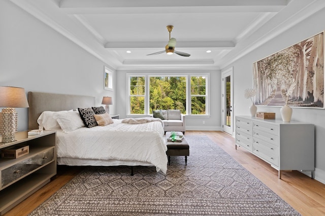 bedroom featuring beam ceiling, wood finished floors, and recessed lighting