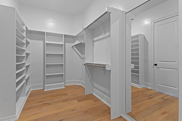 spacious closet with wood finished floors