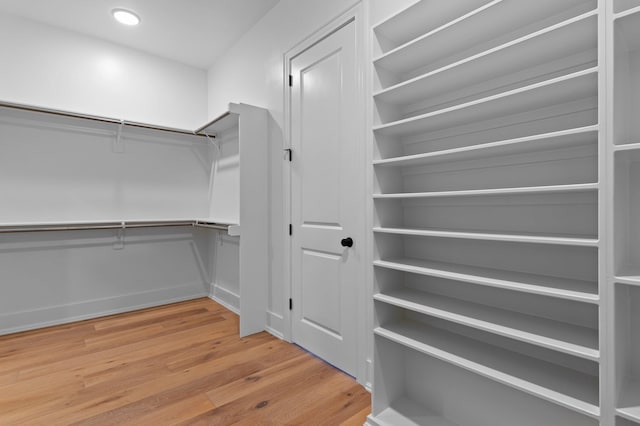 spacious closet with wood finished floors