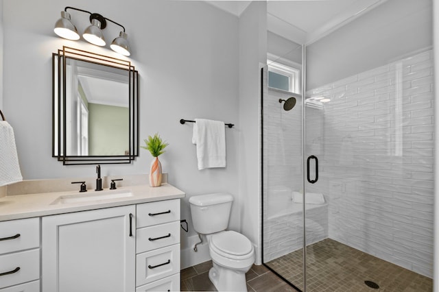 full bath featuring toilet, a stall shower, tile patterned floors, and vanity