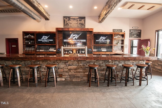 bar with recessed lighting, visible vents, and wet bar