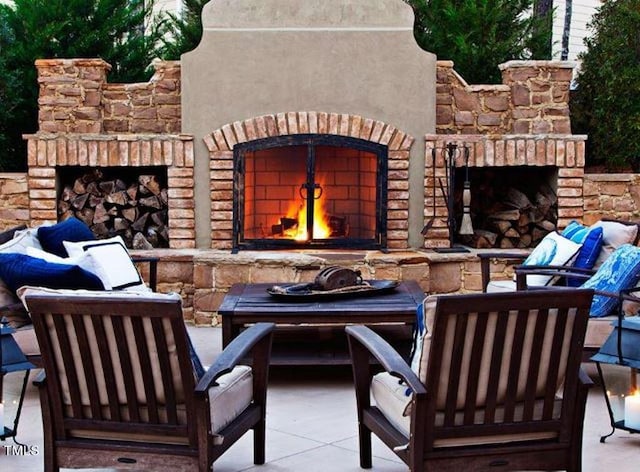 view of patio / terrace with an outdoor brick fireplace