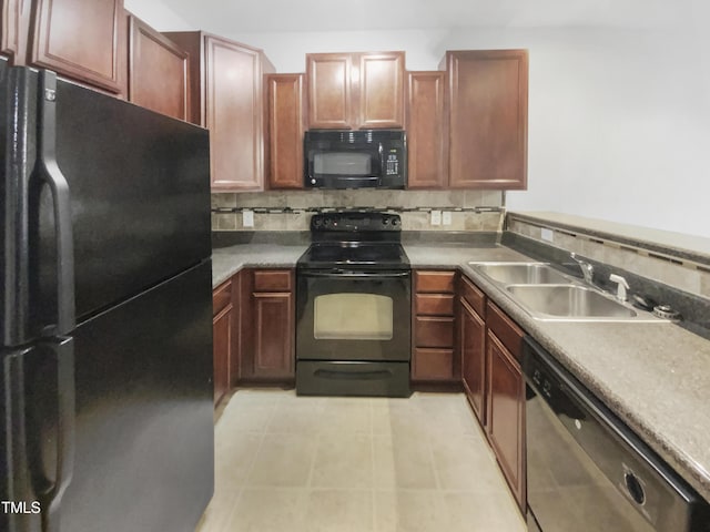 kitchen with decorative backsplash, a sink, black appliances, and light tile patterned floors