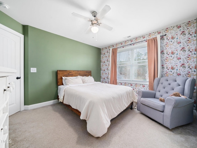 bedroom with baseboards, carpet floors, visible vents, and wallpapered walls