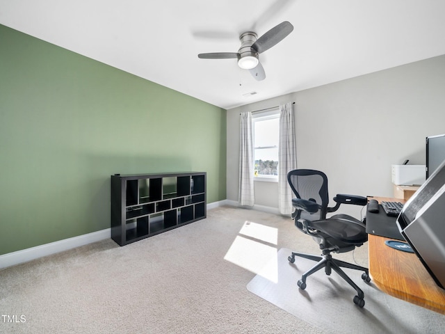 carpeted office space featuring a ceiling fan, visible vents, and baseboards