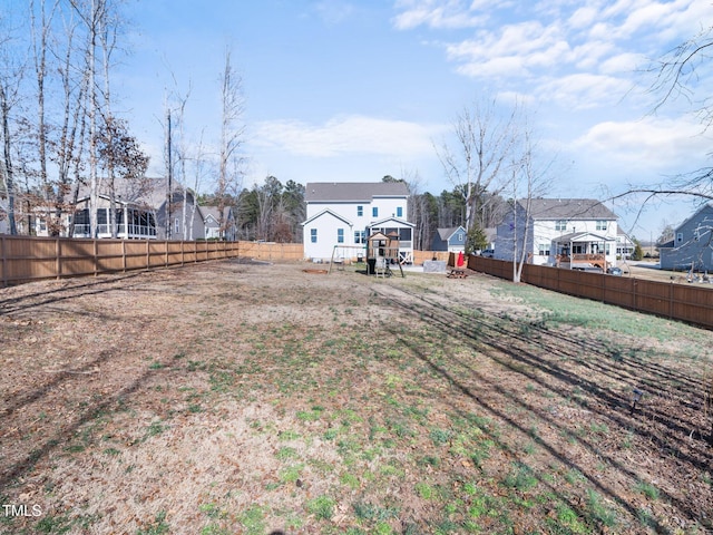 view of yard with a residential view and a fenced backyard