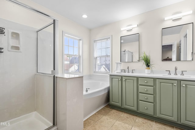 full bathroom featuring a stall shower, a sink, and a bath