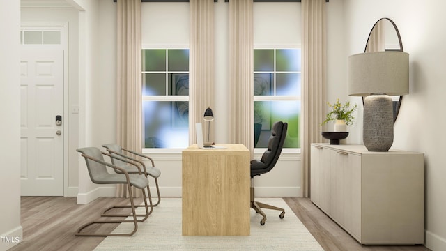 home office featuring light wood finished floors and baseboards