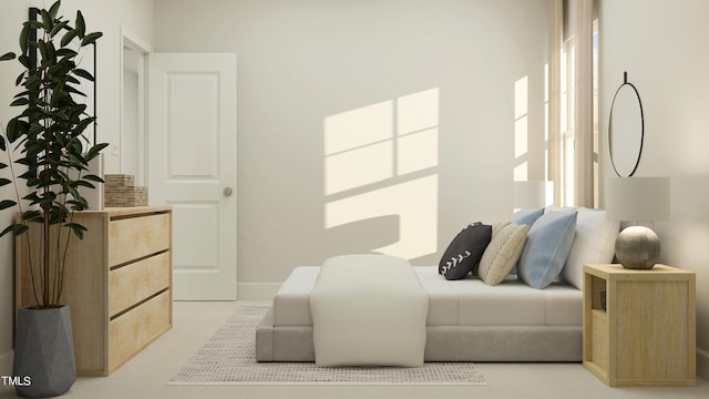 bedroom featuring light colored carpet and baseboards