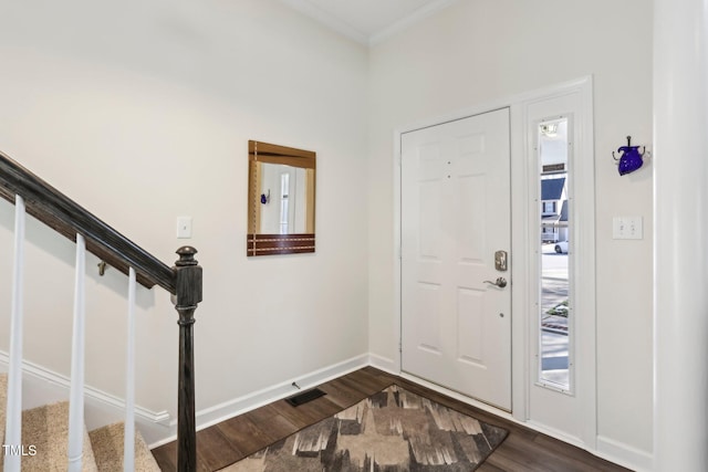 entryway with visible vents, stairs, baseboards, and dark wood-type flooring