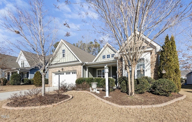 view of front of home featuring board and batten siding, brick siding, and driveway