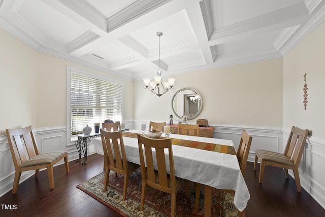 dining space with a notable chandelier, beamed ceiling, and wood finished floors