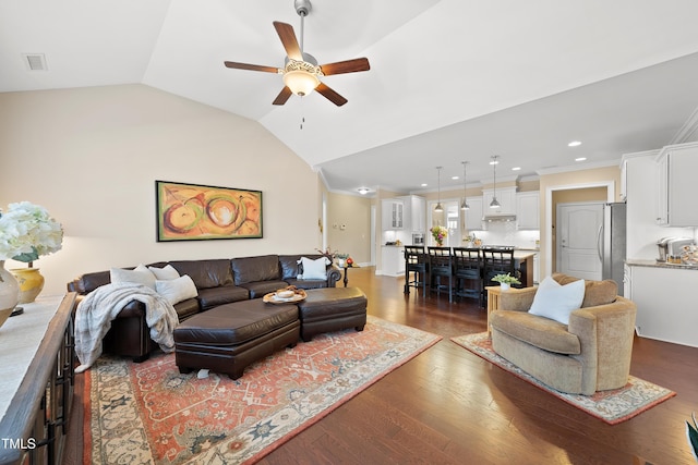 living area with visible vents, ceiling fan, wood finished floors, vaulted ceiling, and recessed lighting