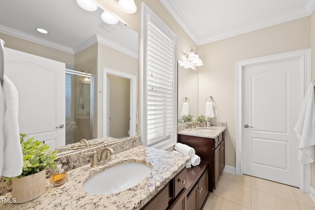 bathroom featuring tile patterned flooring, a shower stall, ornamental molding, and a sink