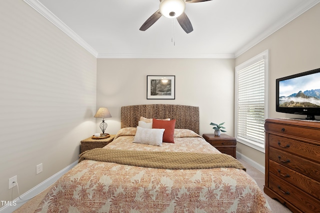 carpeted bedroom featuring baseboards, ornamental molding, and ceiling fan