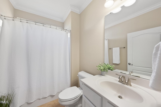 bathroom with vanity, toilet, and crown molding