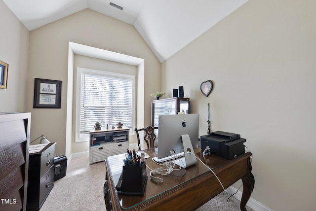 carpeted office space featuring visible vents, vaulted ceiling, and baseboards