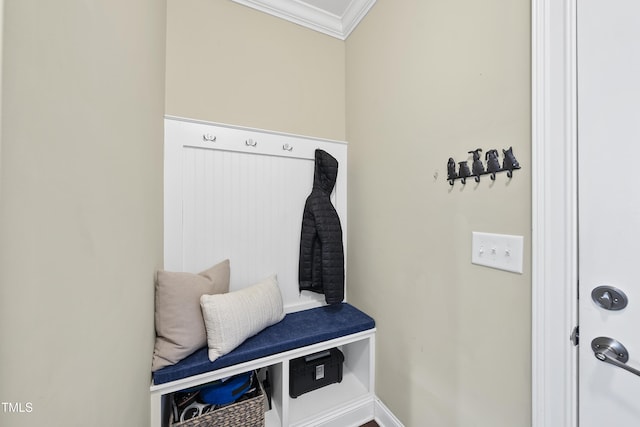 mudroom with ornamental molding and baseboards