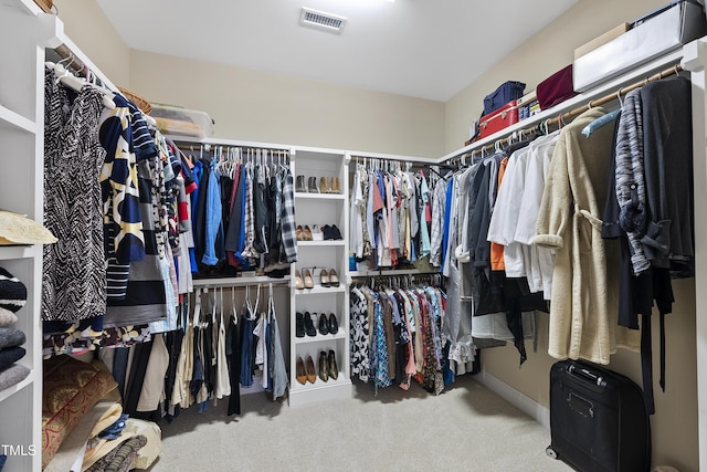 walk in closet featuring carpet and visible vents