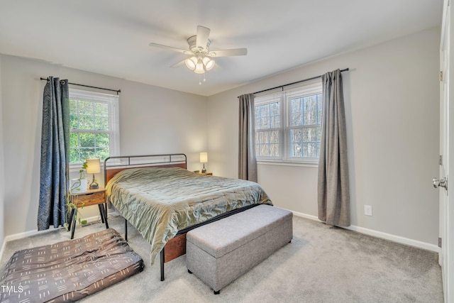 bedroom with carpet, baseboards, and a ceiling fan