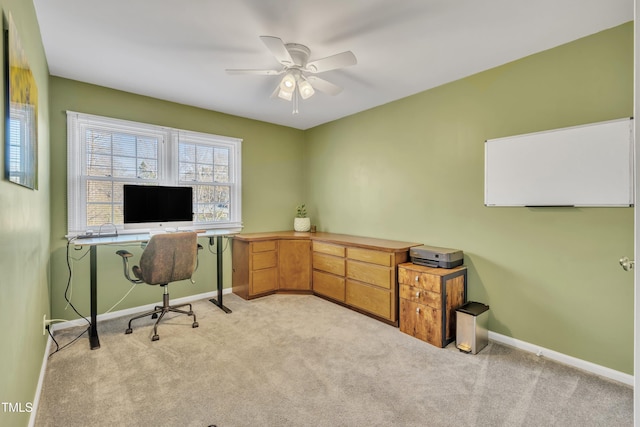 office with light carpet, ceiling fan, and baseboards