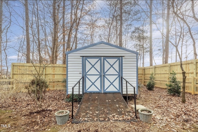 view of shed with a fenced backyard