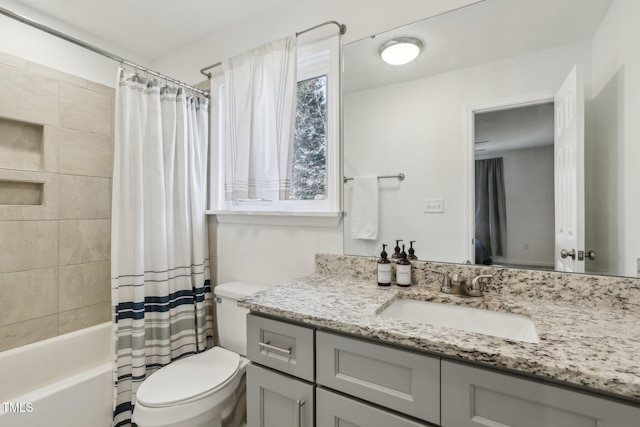 full bath featuring toilet, vanity, and shower / bathtub combination with curtain