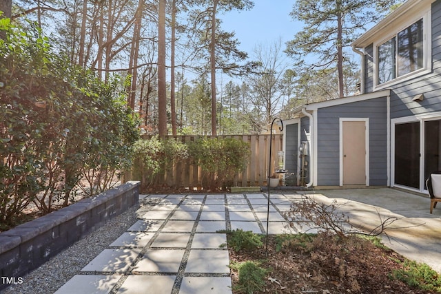 view of patio featuring fence