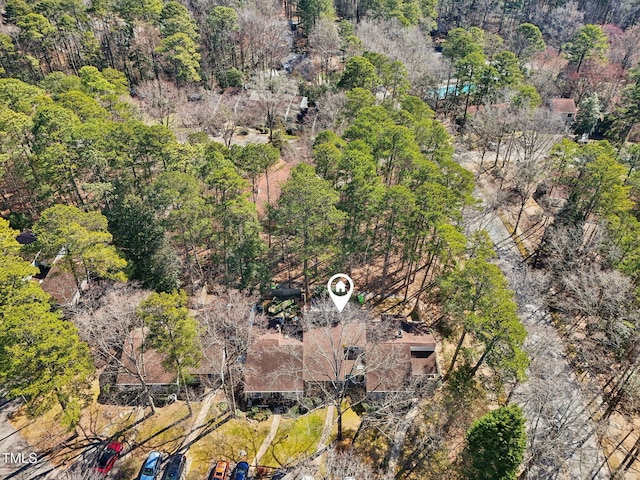 birds eye view of property with a view of trees