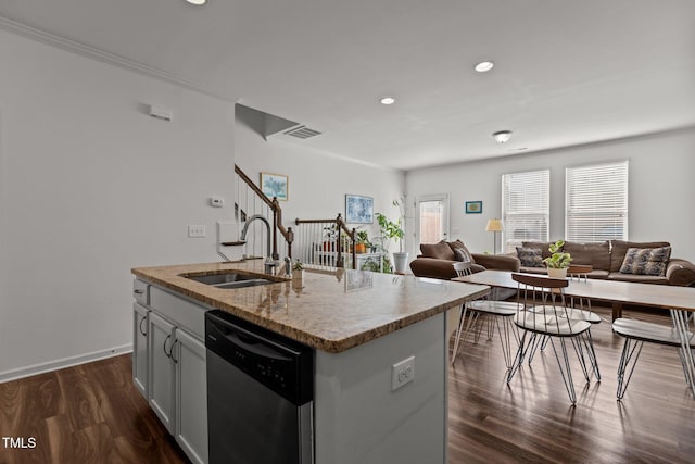 kitchen with dark wood-style floors, visible vents, stainless steel dishwasher, open floor plan, and a sink